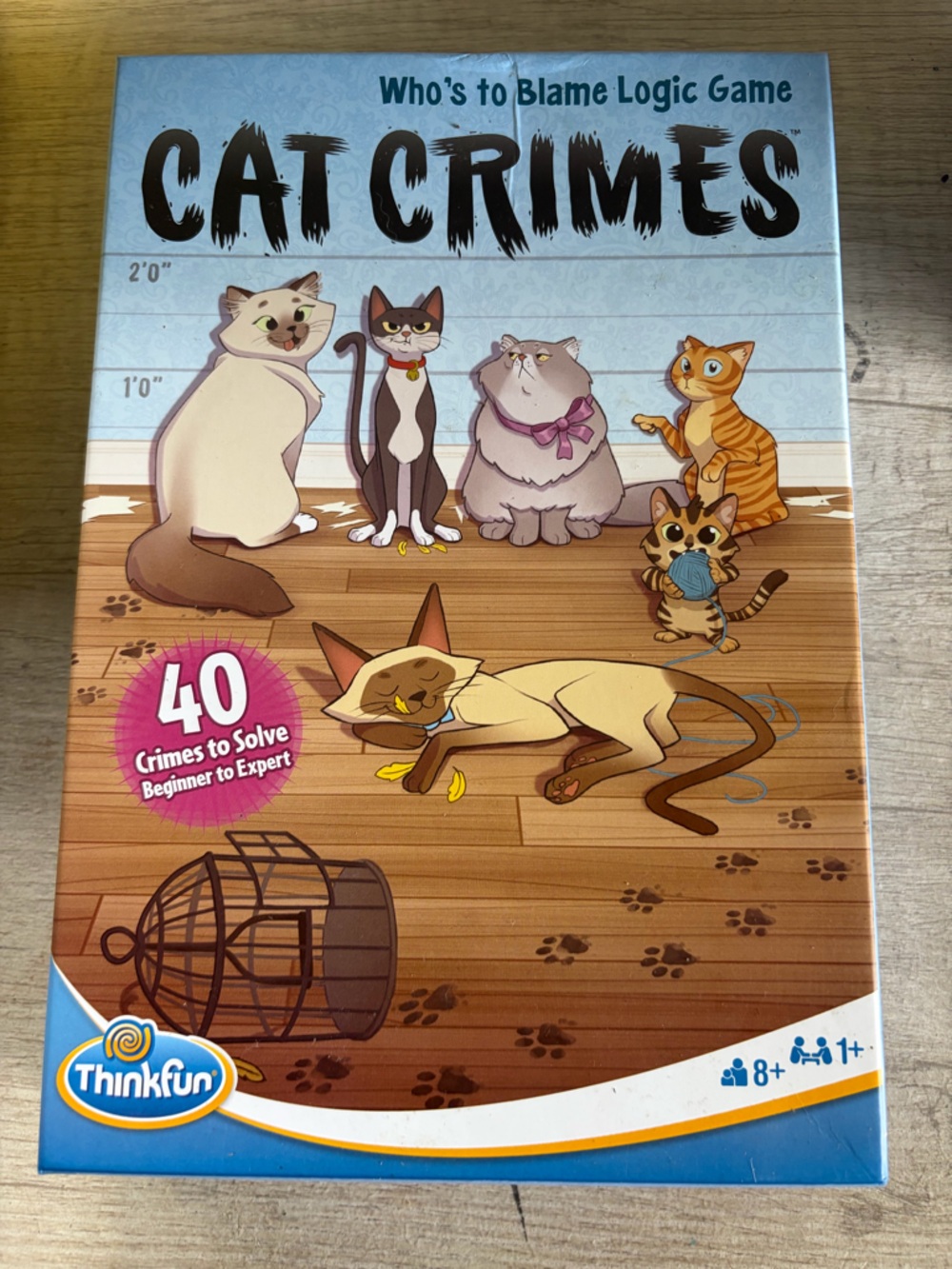 ThinkFun Cat Crimes Logic Game - Blue/Tan Cover